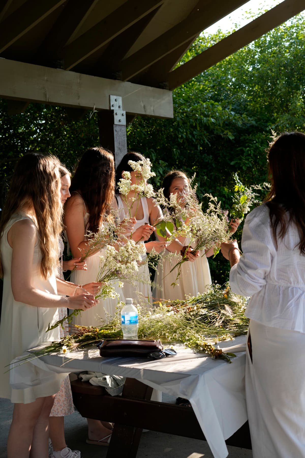 Guests weaving flower crowns