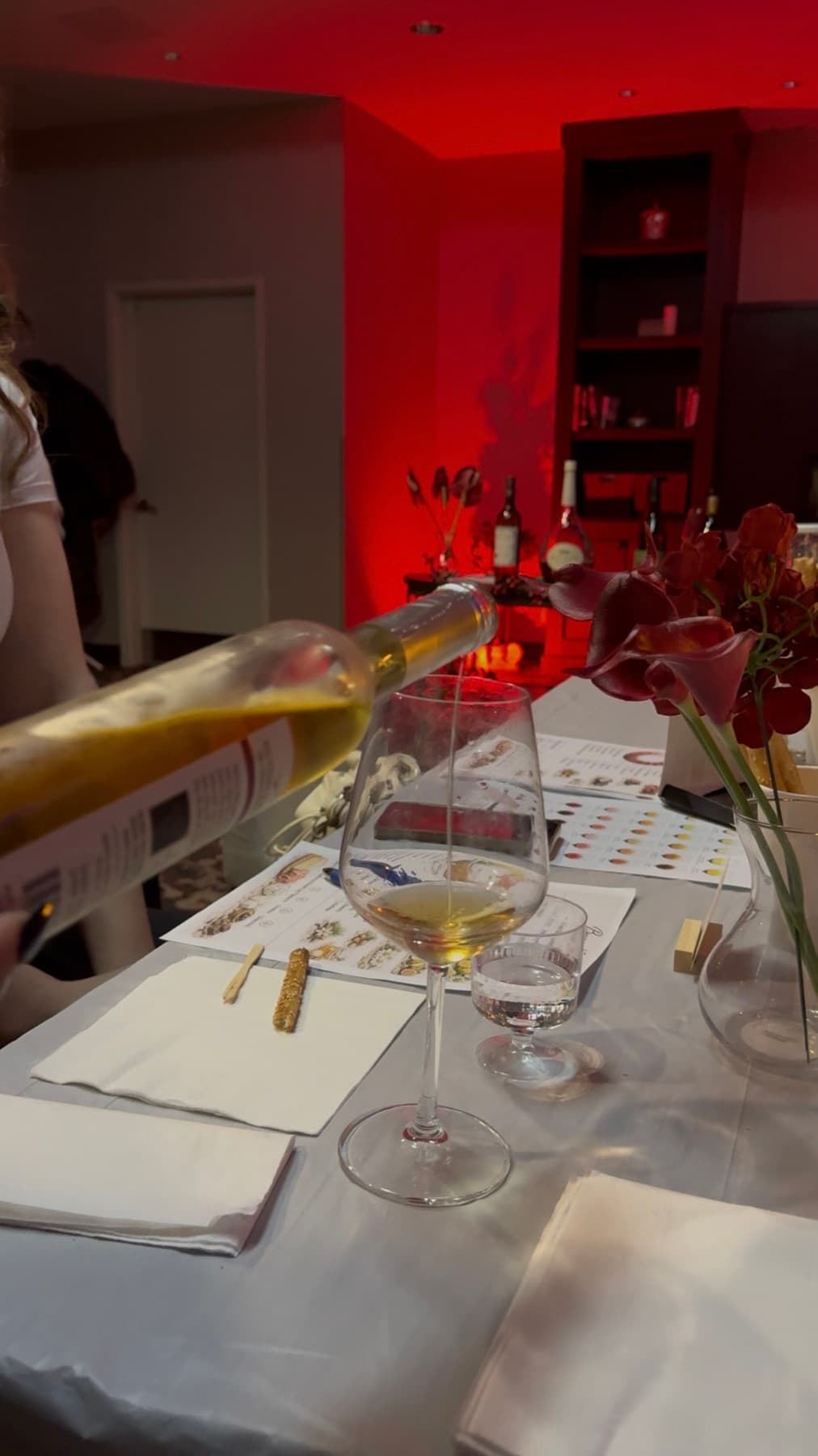 Wine being poured at the tasting dinner