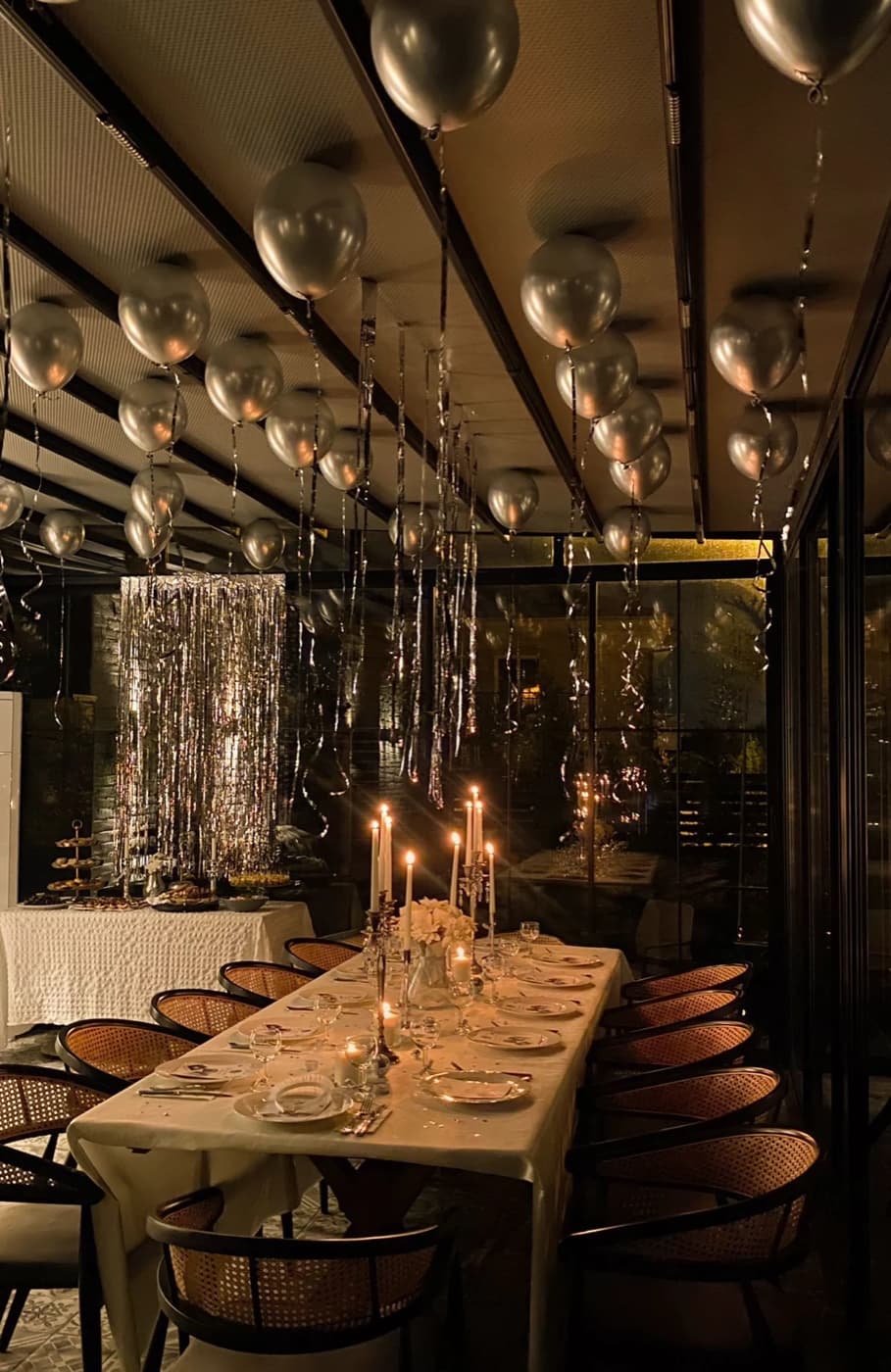 Birthday party with silver balloon arch