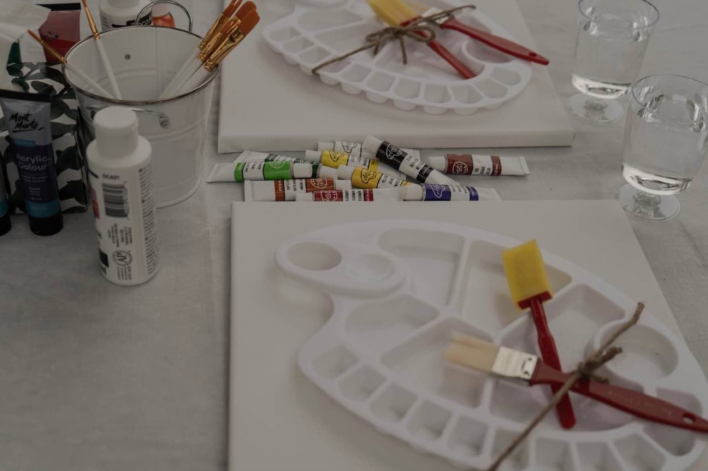 Art workshop with acrylic paints and canvases